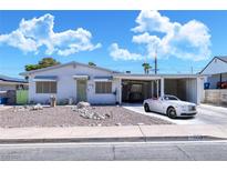 Charming single story home with carport and nicely landscaped front yard at 1704 Hassett Ave, Las Vegas, NV 89104