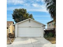 White single car garage with driveway at 1825 Ann Greta Dr, Las Vegas, NV 89108