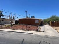 Charming single-story home featuring a fenced front yard and private driveway at 1901 Belmont St, North Las Vegas, NV 89030