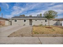 Charming single-story home with a well-maintained lawn and long driveway at 2009 Los Altos St, Las Vegas, NV 89102