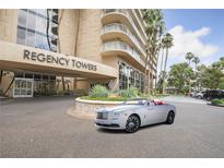 Regency Towers building exterior with landscaping and parking at 3111 Bel Air Dr # 24E, Las Vegas, NV 89109