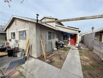 Home's exterior features a driveway and a fenced yard at 3620 Park Oliver Dr, Las Vegas, NV 89110