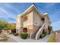 Two-story condo building with stairs and landscaping at 830 Carnegie St # 1712, Henderson, NV 89052