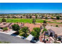 Beautiful community with a golf course view and well-maintained homes under a clear blue sky at 9609 Eagle Valley Dr, Las Vegas, NV 89134