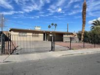 Ranch style home with carport and fenced yard at 2528 Flower Ave, North Las Vegas, NV 89030