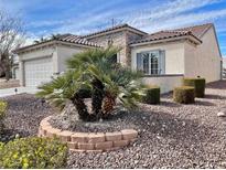 Charming single-story home with desert landscaping, stone accents, and a two-car garage at 2608 Dearport Ct, Henderson, NV 89052