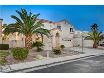 Two-story house with palm trees and a driveway at 2721 Tahiti Isle Ave, North Las Vegas, NV 89031