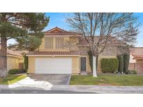 Attractive two-story house with a well-maintained lawn and a two-car garage at 2823 Camelback Ln, Henderson, NV 89074