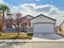 One-story house with attached garage and landscaping at 3807 Aspen Creek Ave, North Las Vegas, NV 89031