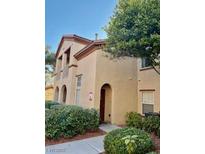 Attractive 2 story condo building with landscaping and walkway at 3815 Juno Beach St # 203, Las Vegas, NV 89129