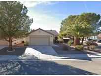 Single-story home with a two-car garage and desert landscaping at 551 Morning Mauve Ave, Las Vegas, NV 89183