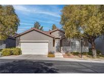 Single-story home with attached garage and landscaped front yard at 5600 Nimes Ave, Las Vegas, NV 89141