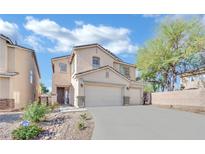 Two-story house with attached garage and landscaping at 6145 Sydney Bay Ct, North Las Vegas, NV 89081