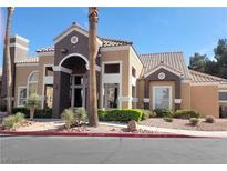 Building exterior with Spanish-style architecture and landscaping at 8101 W Flamingo Rd # 2040, Las Vegas, NV 89147