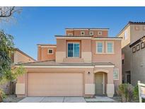 Two-story home featuring a two-car garage and a neutral-colored exterior at 8889 W Torino Ave, Las Vegas, NV 89148