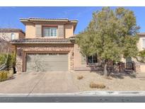 Charming two-story home with stone accents, a two-car garage, and well-maintained landscaping at 12048 La Palmera Ave, Las Vegas, NV 89138