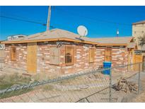 Brick house with a fenced yard at 1220 E Ogden Ave, Las Vegas, NV 89101