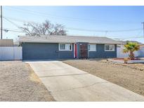 Charming single-story home featuring a well-maintained yard and a concrete driveway at 139 Ivy St, Henderson, NV 89015