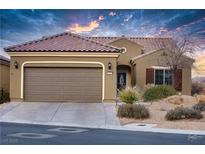 Single-story home with brown garage door and desert landscaping at 1460 Tannery Hts, Mesquite, NV 89034