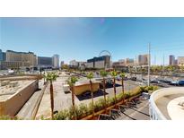 Aerial view of the property, showing the surrounding cityscape and nearby attractions at 211 E Flamingo Rd # 202, Las Vegas, NV 89169