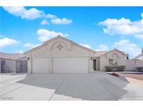 Charming single-story home with a three-car garage and a well-maintained front yard at 3923 Gramercy Ave, North Las Vegas, NV 89031