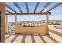 Spacious balcony features wooden pergola offering scenic neighborhood views at 457 Turtleback Rd # D, Mesquite, NV 89027