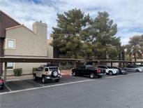 Exterior view of apartment building with covered parking at 5046 S Rainbow Blvd # 103, Las Vegas, NV 89118