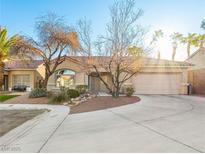 Charming single-story home with well-manicured front yard and circular driveway at 8474 Orange Cliff Ct, Las Vegas, NV 89123