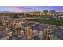 Luxury condos with golf course views and city skyline in the background at 9201 Las Manaitas Ave # 302, Las Vegas, NV 89144