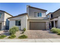 Two-story home with brown garage door and landscaped front yard at 9281 Albus Hills Ave, Las Vegas, NV 89143