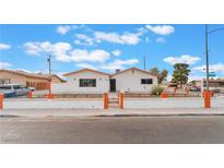 Charming single story home featuring an orange trim and a decorative fence at 1309 Jimmy Ave, Las Vegas, NV 89106