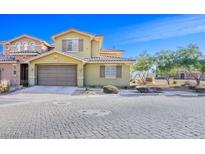 Charming two-story home featuring a neutral color scheme, well-manicured landscaping, and a two-car garage at 4 Via Centrale # 3, Henderson, NV 89011