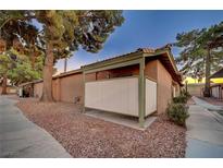 Cozy home featuring desert landscaping, secure patio area, and tiled roof at 413 N Lamb Blvd # E, Las Vegas, NV 89110