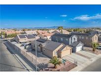 Aerial view of a single-Gathering home with solar panels and a landscaped yard at 4314 Flaming Ridge Trl, Las Vegas, NV 89147