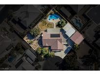 Aerial view of a house with pool and landscaped yard at 5625 W Agate Ave, Las Vegas, NV 89139