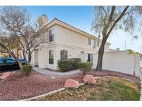 Two story house with landscaping and driveway at 7987 Cina Ave, Las Vegas, NV 89147