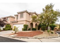 Charming two-story home with a well-maintained yard, a two-car garage, and mature landscaping at 10127 Capistrello Ave, Las Vegas, NV 89147