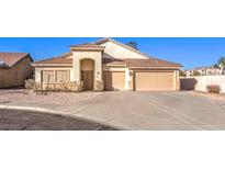 Charming single Gathering home with an attached two car garage and low maintenance landscaping at 1056 Flatfoot Ave, Henderson, NV 89012
