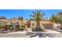 Charming single-story home with a well-manicured front yard and mature landscaping at 2277 Canyonville Dr, Henderson, NV 89044