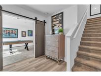 Inviting home entrance featuring a modern staircase and decorative accents that offers easy access to a game room at 2827 Blue Mosaic Ln # 3, Las Vegas, NV 89183