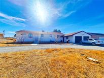 Single story home with attached garage and large yard at 2851 Goldrush St, Pahrump, NV 89048