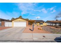 Charming single-story home with a two-car garage and low maintenance desert landscaping at 4110 Oakhill Ave, Las Vegas, NV 89121