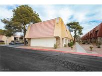 Tan colored building with red tile roof.Landscaped grounds with walkways at 5493 Indian River Dr # 376, Las Vegas, NV 89103