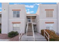Two-story building exterior with stairs and landscaping at 6800 E Lake Mead Blvd # 2035, Las Vegas, NV 89156