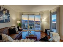 Elegant living room featuring hardwood floors, stylish furniture, and a stunning city view at 2777 Paradise Rd # 1105, Las Vegas, NV 89109