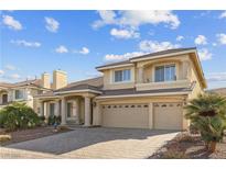 Charming two-story home featuring a three-car garage and a well-maintained front yard at 4439 Melrose Abbey Pl, Las Vegas, NV 89141