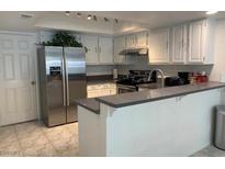 Modern kitchen with stainless steel appliances and gray countertops at 6250 W Flamingo Rd # 88, Las Vegas, NV 89103