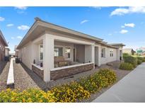 Charming single-story home featuring a covered front porch, landscaped yard, and a welcoming entrance at 723 Orange Plume Walk # 0, Henderson, NV 89011
