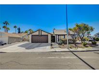 Charming single-story home featuring a well-manicured yard and inviting curb appeal at 7559 Silver Leaf Way, Las Vegas, NV 89147