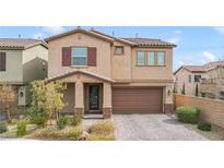 Two-story house with brown garage door and landscaped yard at 8136 Little Skye Ct, Las Vegas, NV 89166
